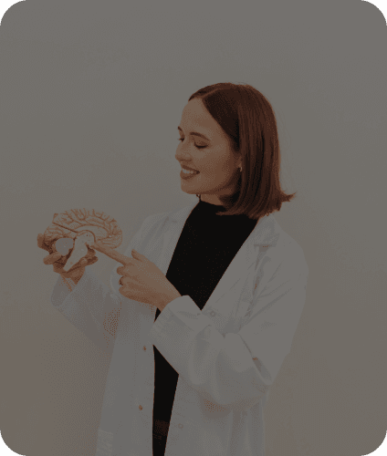 Woman holding brain anatomy model